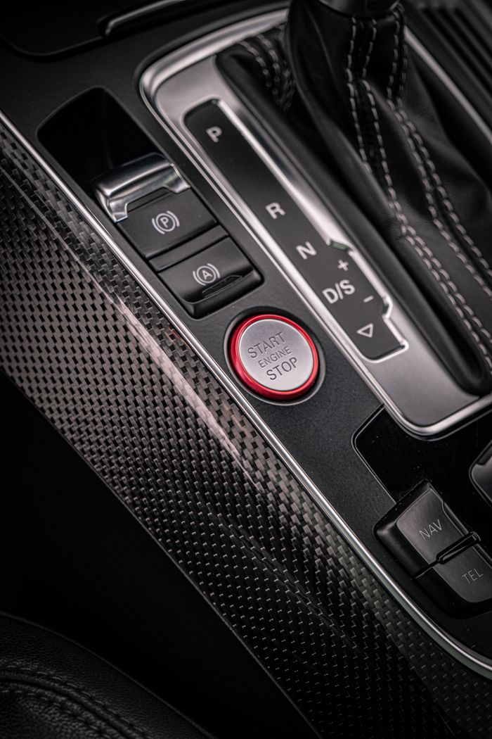 About Close-up view of Audi RS5 interior center console showcasing modern design elements.